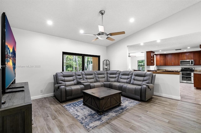 11377 NW 21st Ct, Coral Springs, FL 33071 - living area with a ceiling fan, light wood-style flooring, recessed lighting, and vaulted ceiling