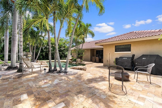 11377 NW 21st Ct, Coral Springs, FL 33071 - view of patio / terrace featuring a fire pit, an outdoor pool, and a grill