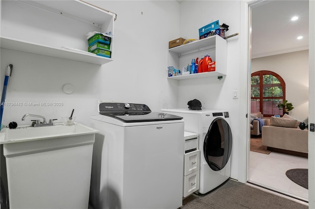 laundry room with laundry area, recessed lighting, dark tile patterned floors, and washer and dryer