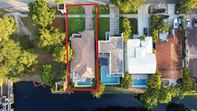 birds eye view of property featuring a water view