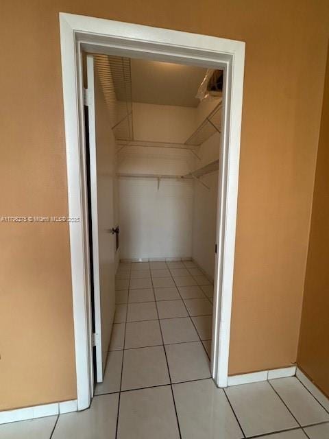 7400 W 20th Ave Unit 326, Hialeah, FL 33016 - spacious closet featuring light tile patterned floors