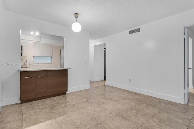 716 Michigan Ave Unit 204, Miami Beach, FL 33139 - kitchen with range with electric cooktop, stainless steel microwave, a sink, light countertops, and tasteful backsplash