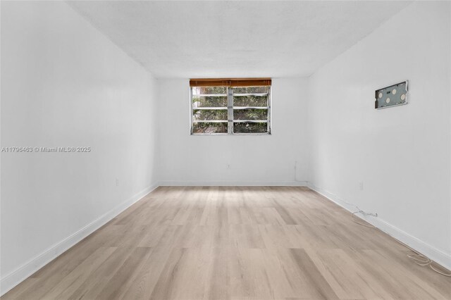 716 Michigan Ave Unit 204, Miami Beach, FL 33139 - shared laundry area featuring washing machine and dryer and light tile patterned flooring