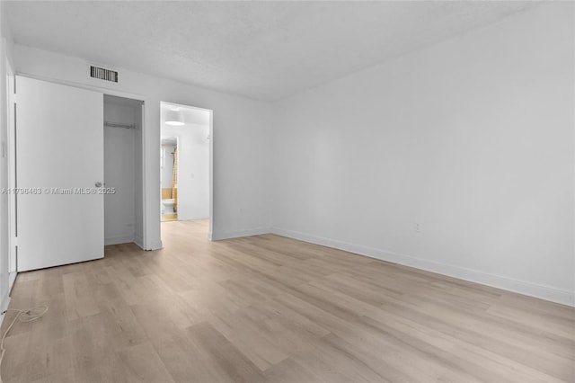 716 Michigan Ave Unit 204, Miami Beach, FL 33139 - unfurnished bedroom featuring light wood-style floors, baseboards, and a closet