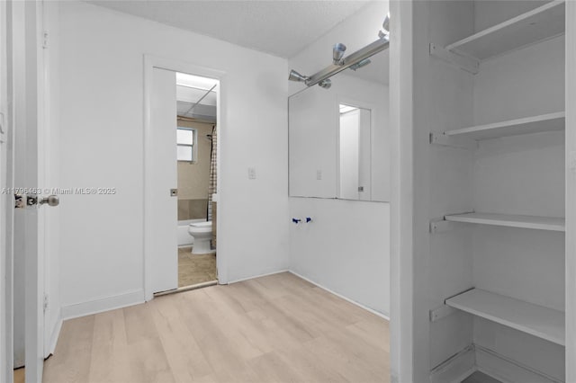 716 Michigan Ave Unit 204, Miami Beach, FL 33139 - bathroom with toilet and wood finished floors