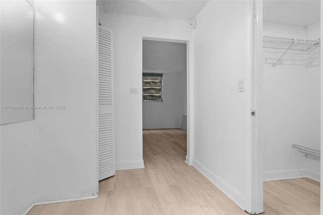 716 Michigan Ave Unit 204, Miami Beach, FL 33139 - hall featuring light wood-style flooring and baseboards