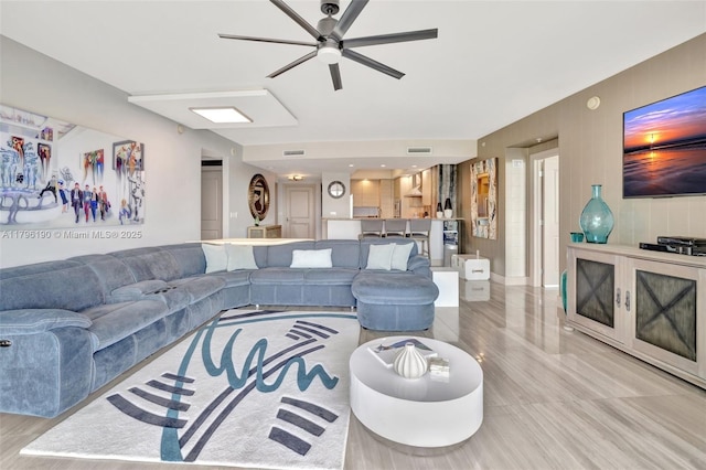 living room with visible vents and ceiling fan