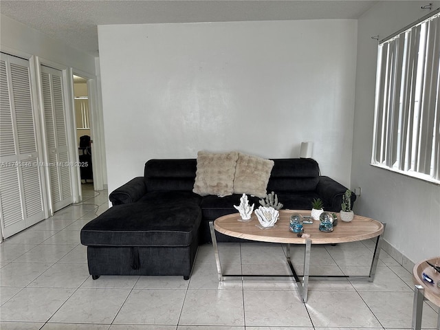 living area featuring light tile patterned floors