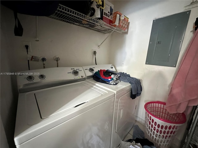 laundry area with independent washer and dryer, laundry area, and electric panel
