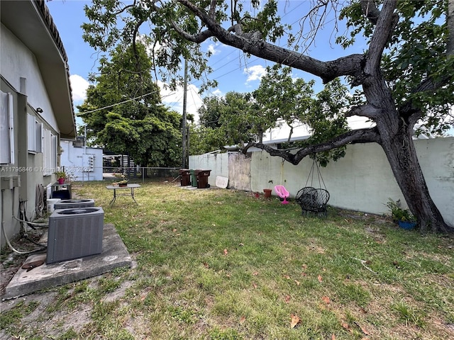 view of yard with a fenced backyard and cooling unit