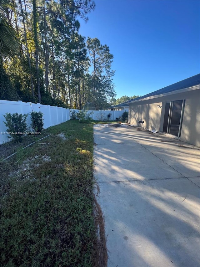 203 Palmwood Dr, Palm Coast, FL 32164 - view of yard with a patio area and a fenced backyard