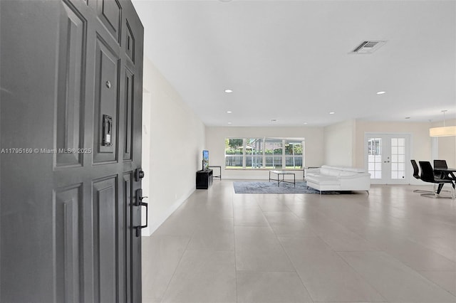1438 Harrison St, Hollywood, FL 33020 - foyer entrance featuring recessed lighting, baseboards, light tile patterned floors, and french doors