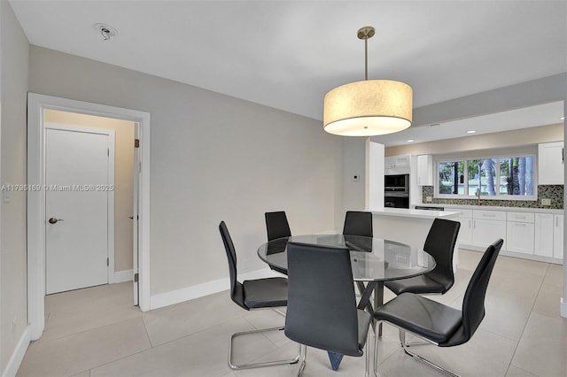 1438 Harrison St, Hollywood, FL 33020 - dining room featuring light tile patterned floors and baseboards