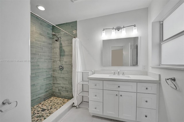 1438 Harrison St, Hollywood, FL 33020 - bathroom featuring a tile shower, vanity, and tile patterned flooring