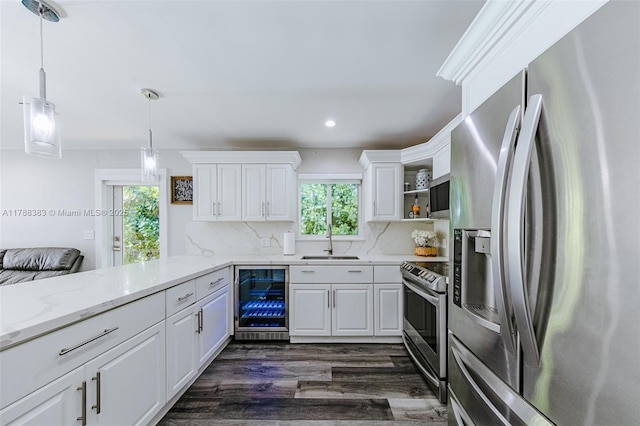 13305 SW 22nd Ter, Miami, FL 33175 - kitchen with beverage cooler, plenty of natural light, stainless steel appliances, and a sink