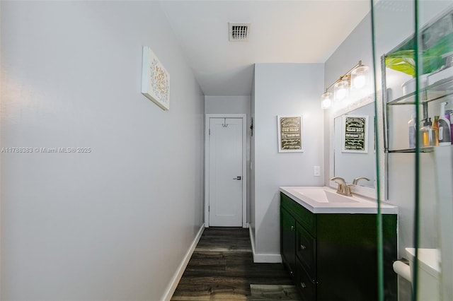 13305 SW 22nd Ter, Miami, FL 33175 - bathroom with vanity, baseboards, visible vents, and wood finished floors