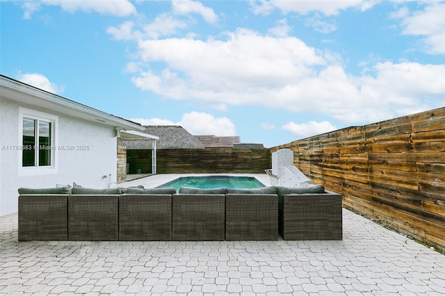 13305 SW 22nd Ter, Miami, FL 33175 - view of pool with outdoor lounge area, a patio area, a fenced in pool, and a fenced backyard
