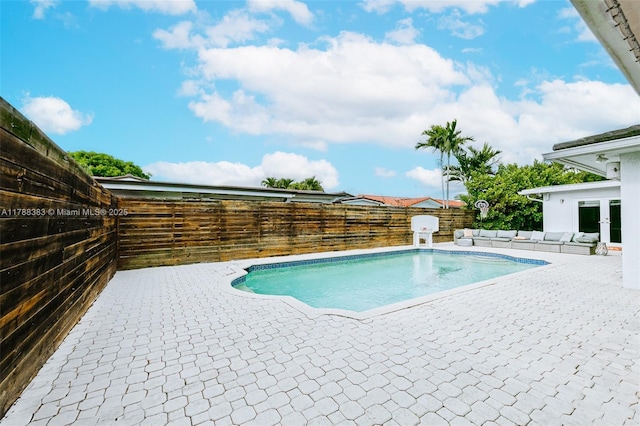 13305 SW 22nd Ter, Miami, FL 33175 - view of swimming pool featuring a patio, french doors, a fenced in pool, and a fenced backyard