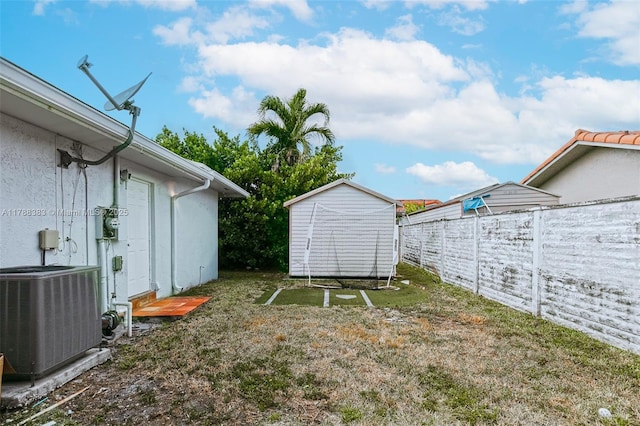 13305 SW 22nd Ter, Miami, FL 33175 - view of yard featuring central air condition unit, an outdoor structure, a storage shed, and fence