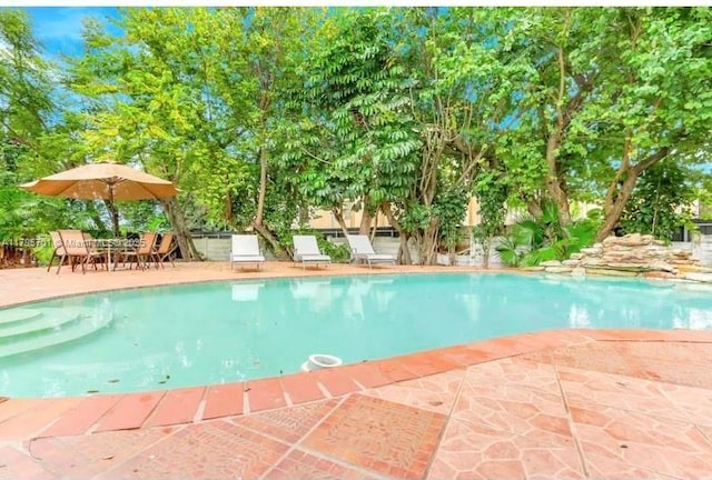 outdoor pool featuring a patio area