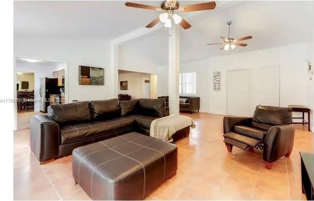 living room with a ceiling fan, light tile patterned floors, and high vaulted ceiling