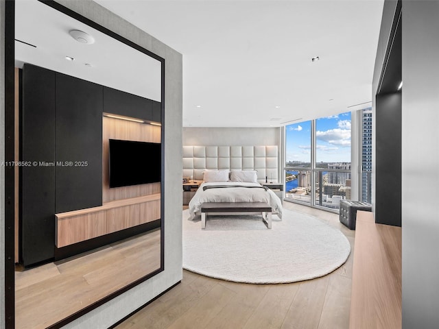 3101 S Ocean Dr Unit 2905, Hollywood, FL 33019 - bedroom featuring expansive windows and wood finished floors