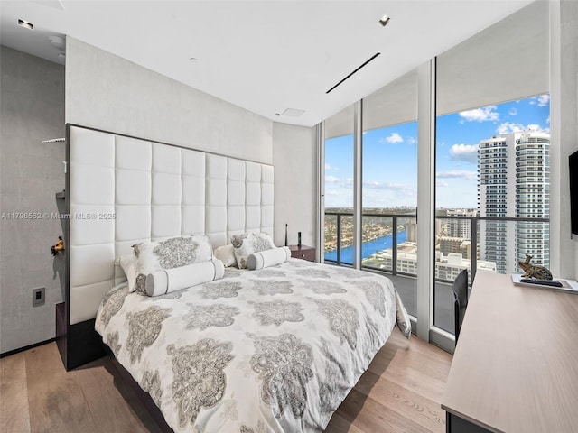 3101 S Ocean Dr Unit 2905, Hollywood, FL 33019 - bedroom with light wood-style floors and a wall of windows