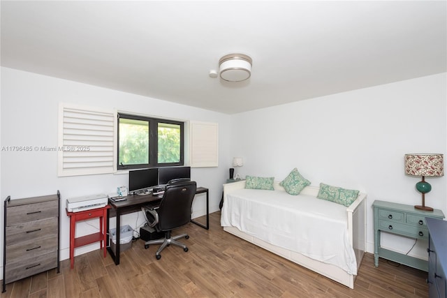bedroom with wood finished floors