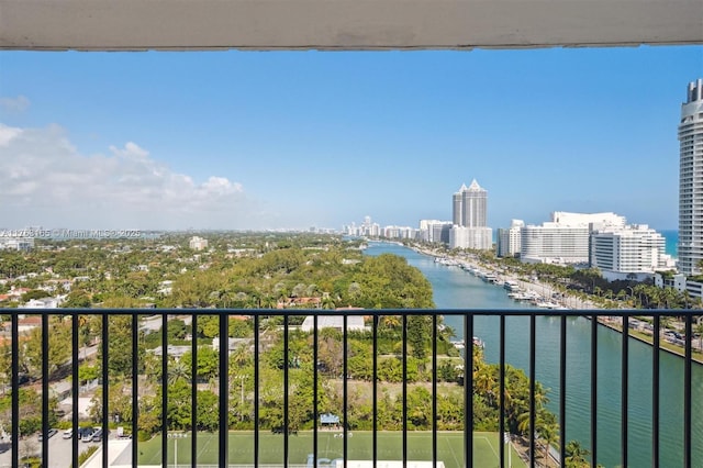 balcony featuring a water view and a view of city