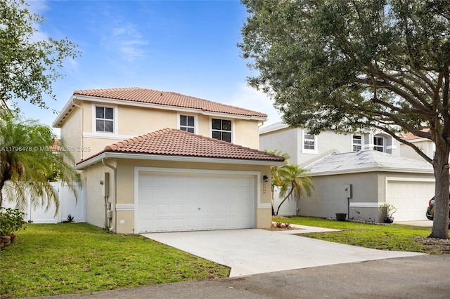 view of front of property with driveway, a tile roof, a garage, stucco siding, and a front yard