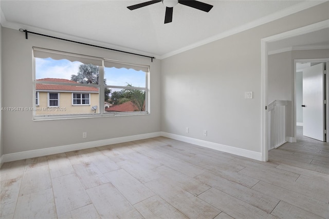 unfurnished room featuring crown molding, baseboards, a ceiling fan, and wood finished floors