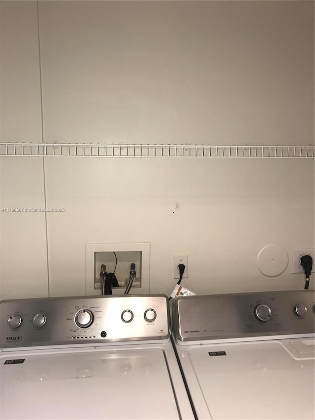 laundry room featuring laundry area and washer and clothes dryer
