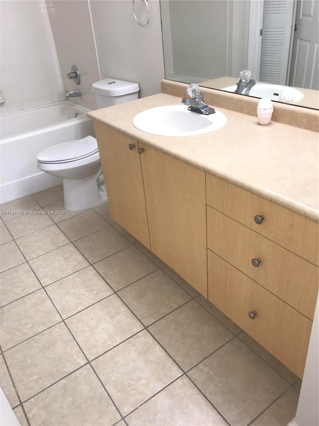 full bathroom featuring toilet, bathing tub / shower combination, tile patterned flooring, and vanity