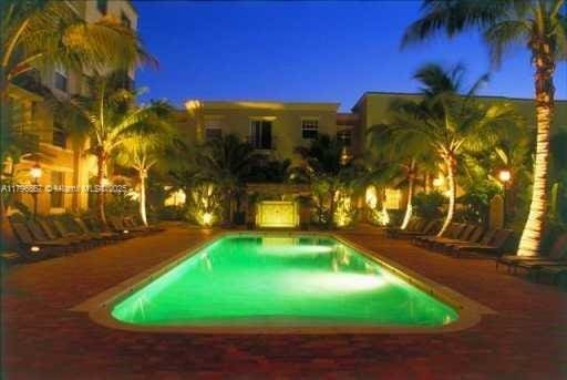 view of pool at night