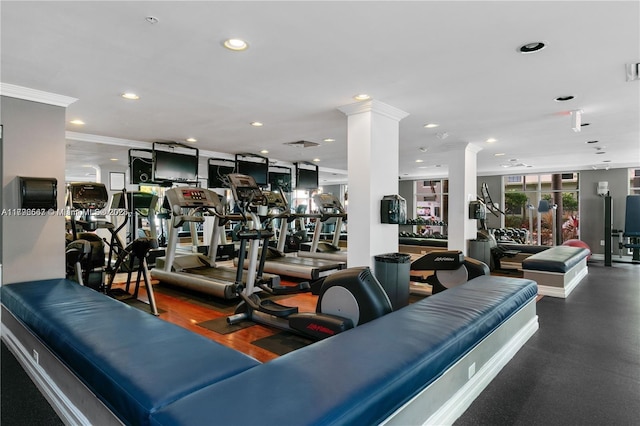 workout area featuring crown molding, decorative columns, visible vents, and recessed lighting