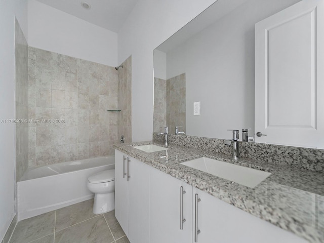bathroom featuring toilet, bathtub / shower combination, double vanity, and a sink