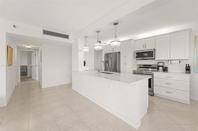 4001 Hillcrest Dr Unit 1017, Hollywood, FL 33021 - kitchen featuring a sink, stainless steel appliances, light tile patterned flooring, visible vents, and baseboards