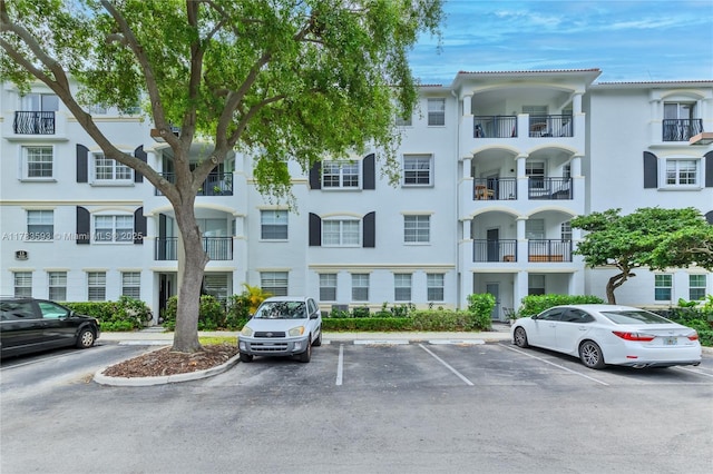 view of property featuring uncovered parking
