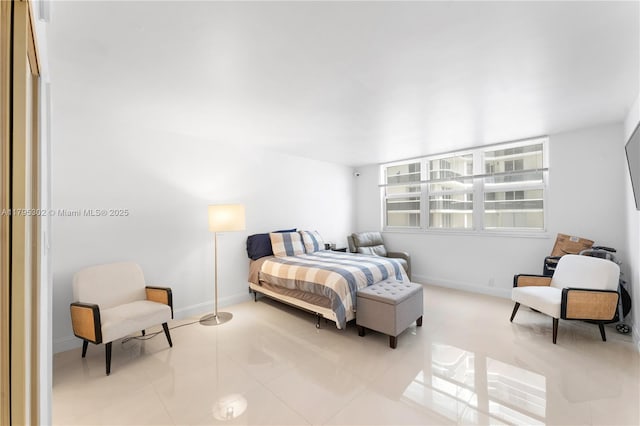 bedroom featuring baseboards