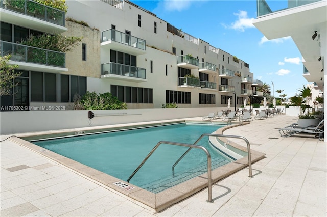 community pool featuring a patio