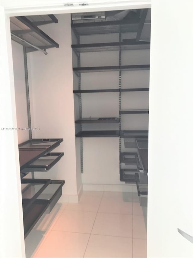 walk in closet featuring tile patterned floors