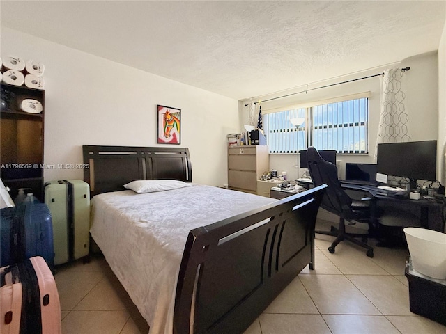 bedroom with light tile patterned floors