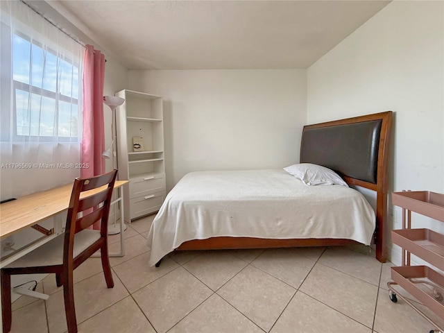 bedroom with light tile patterned flooring