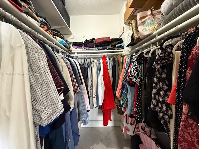 walk in closet featuring tile patterned floors