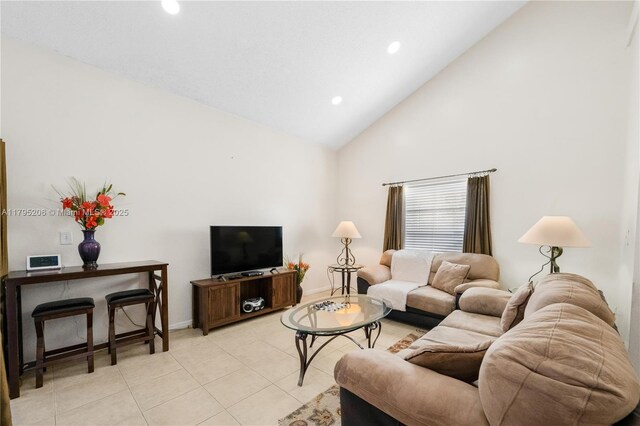 1249 NW 126th Ter, Sunrise, FL 33323 - living area featuring high vaulted ceiling, recessed lighting, light tile patterned floors, and baseboards