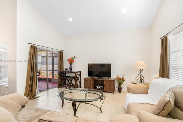 1249 NW 126th Ter, Sunrise, FL 33323 - living room featuring light tile patterned flooring, high vaulted ceiling, recessed lighting, and baseboards