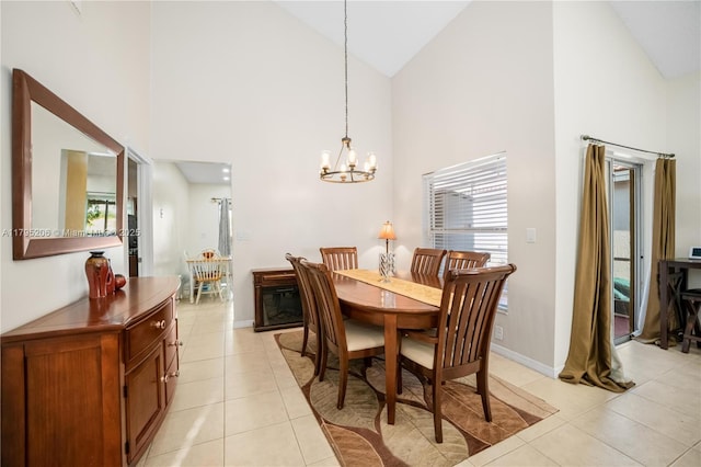 1249 NW 126th Ter, Sunrise, FL 33323 - dining area featuring high vaulted ceiling, plenty of natural light, light tile patterned floors, a chandelier, and baseboards