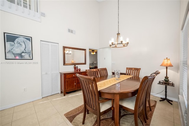 1249 NW 126th Ter, Sunrise, FL 33323 - dining room featuring a chandelier, baseboards, a high ceiling, light tile patterned floors, and a ceiling fan