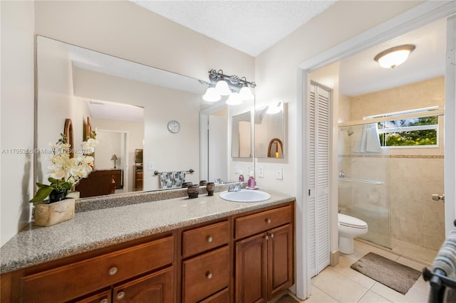 1249 NW 126th Ter, Sunrise, FL 33323 - full bathroom featuring a shower stall, tile patterned flooring, vanity, a closet, and toilet