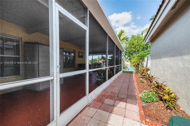 1249 NW 126th Ter, Sunrise, FL 33323 - view of property exterior featuring a sunroom and stucco siding